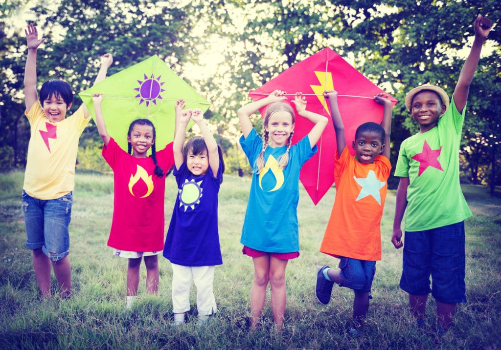 happy kids flying kites