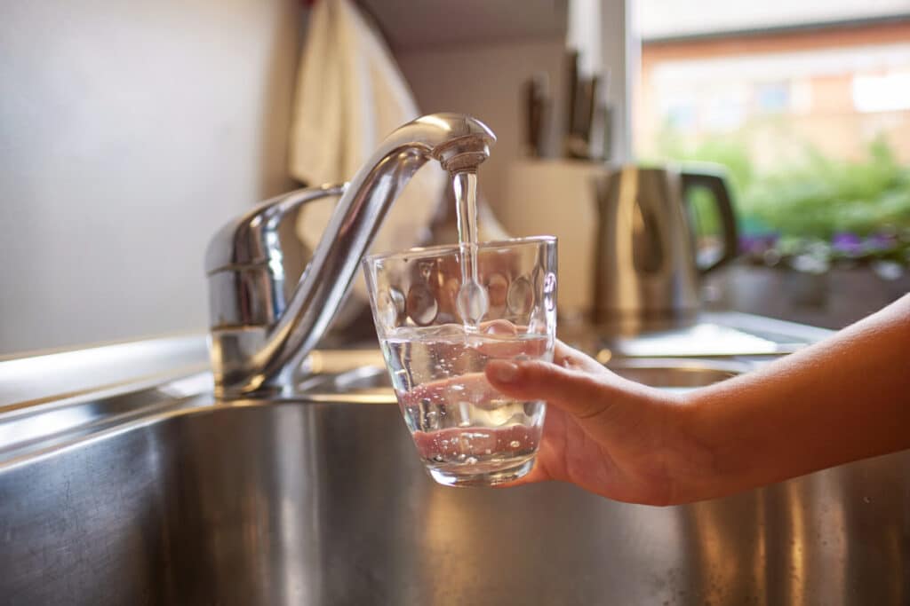 fill glass of tap water